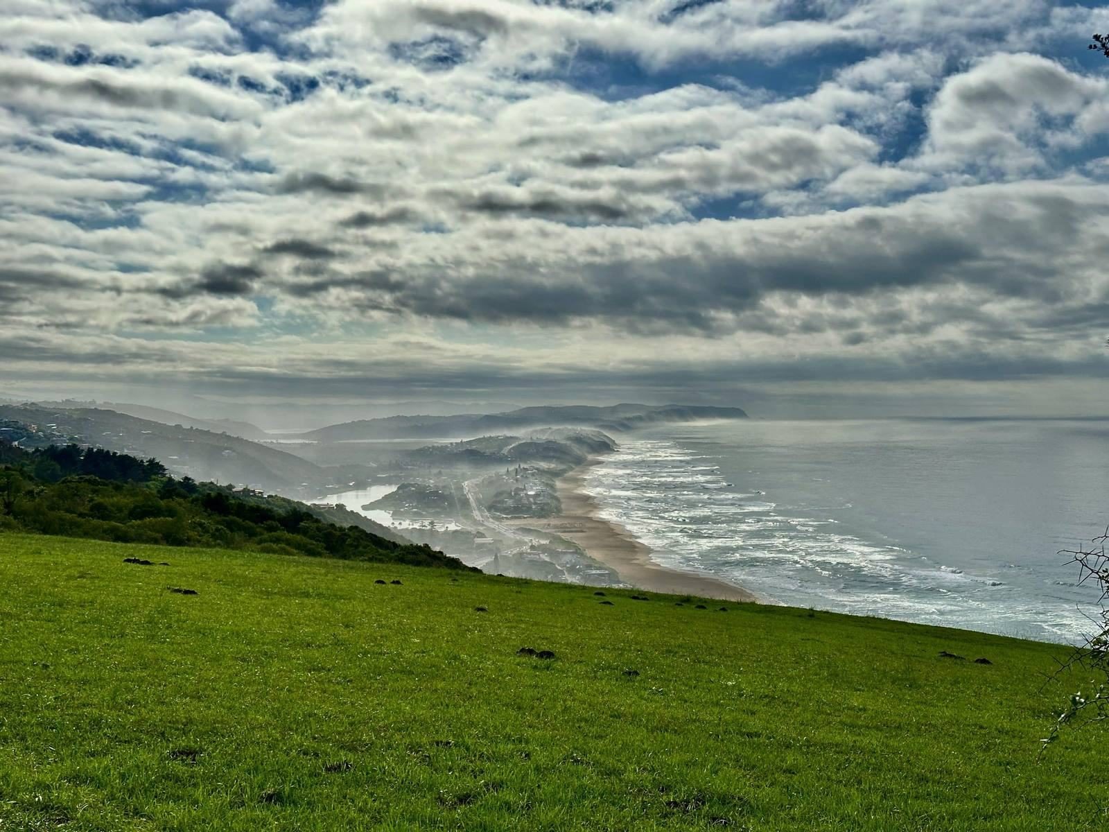 View over green lawn to the Wilderness coastline and the Indian Ocean